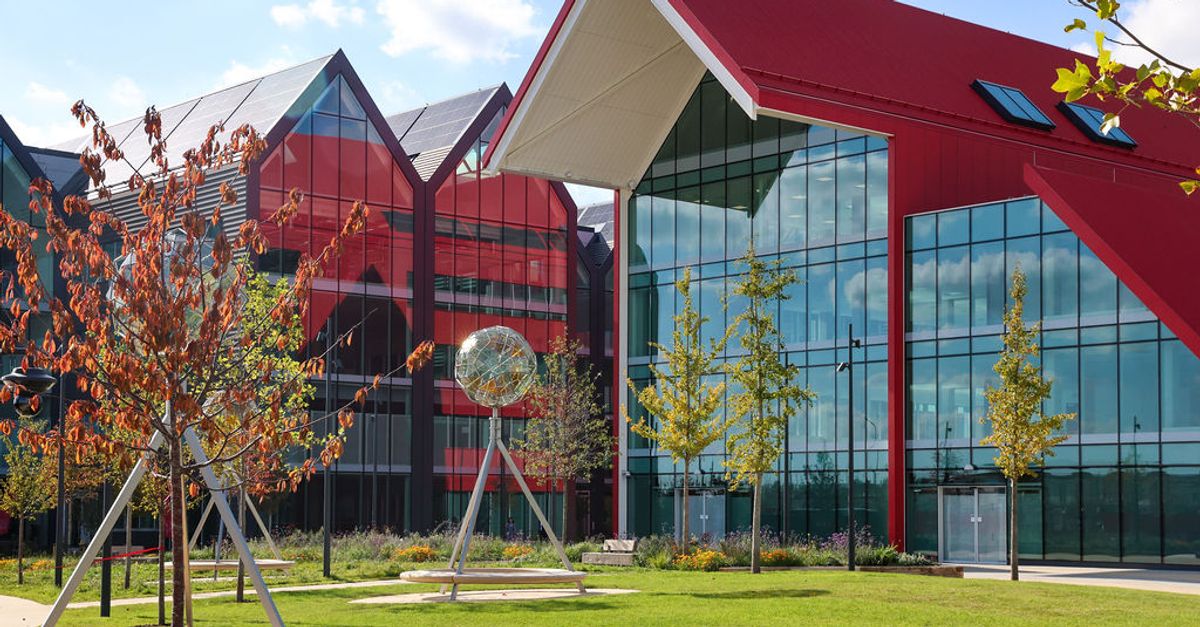 Oxford North campus: red gabled buildings and glass facades above a green lawn