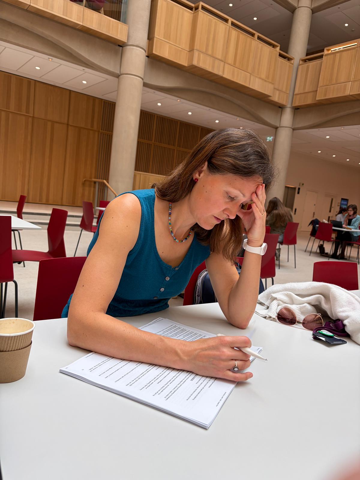 Katy Tuncer writing, photographed by Hakon Hoydal